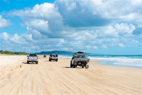 4wd Vehicles at Rainbow Beach with Coloured Sand Dunes, QLD, Australia ...