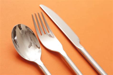 Free Image of Silver Spoon, Fork, and Knife on Orange Background ...