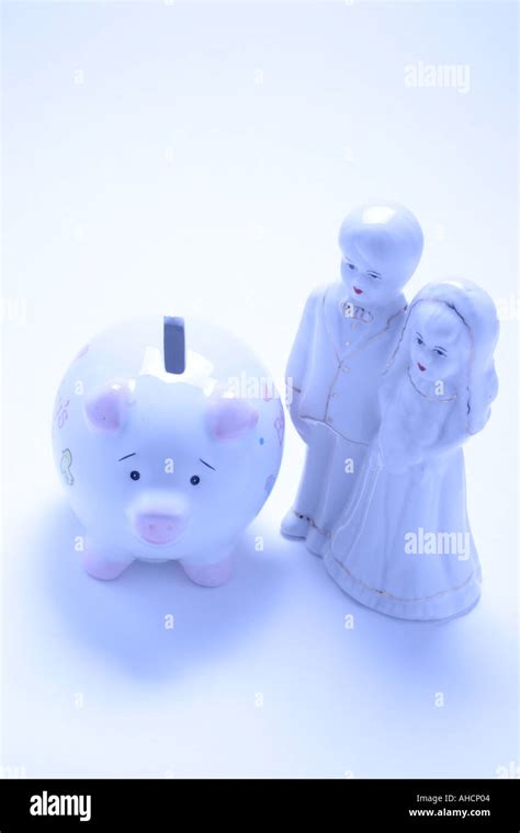 Wedding Couple Figurine and Piggy Bank Stock Photo - Alamy