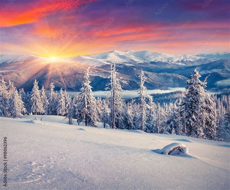 Colorful winter sunrise in the mountains. Stock Photo | Adobe Stock