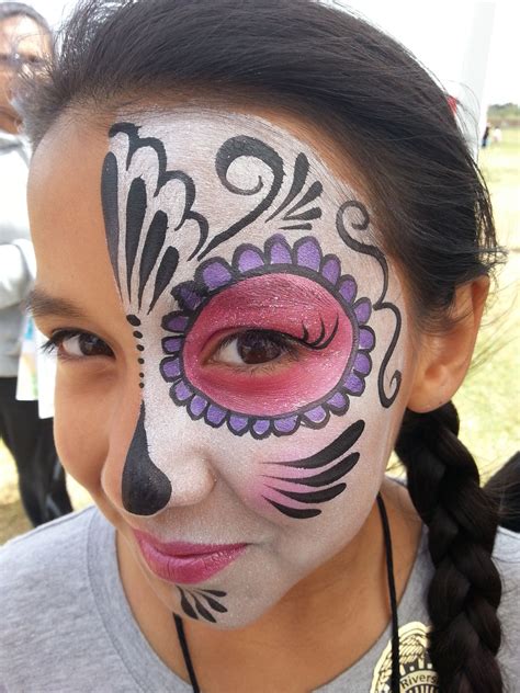 Simple and pretty half day of the dead/sugar skull face painting makeup ...