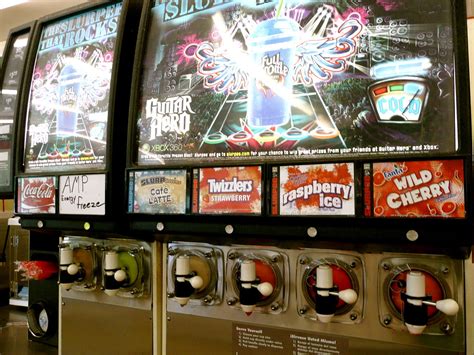 Slurpee machine at 7-11 with Guitar Hero display | Denver, C… | Flickr