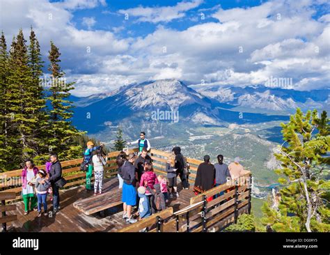 Visitors on a Viewing platform on Sulphur Mountain summit overlooking ...