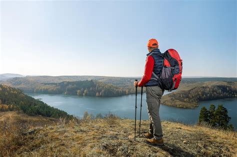 Premium Photo | Man hiking in mountains enjoying autumn nature ...