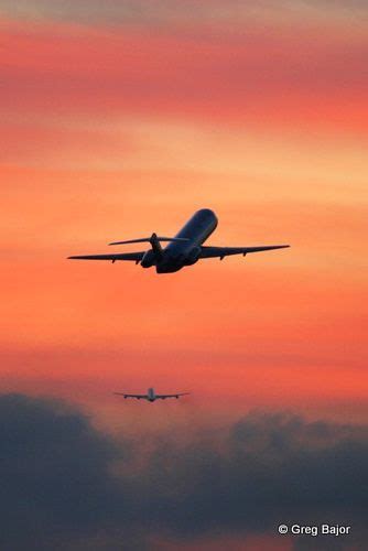 Two Airplanes Flying in the Sunset