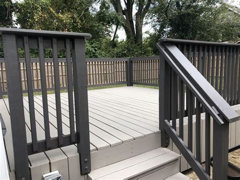 an outdoor deck with stairs leading up to it