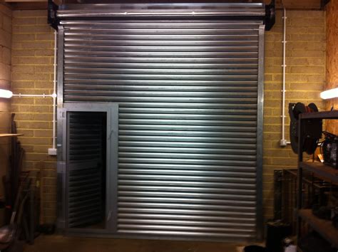 Roller shutter door with a wicket door incorporated. | Shutter doors ...