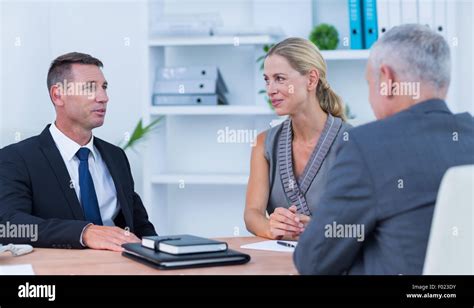 Happy business people in meeting Stock Photo - Alamy