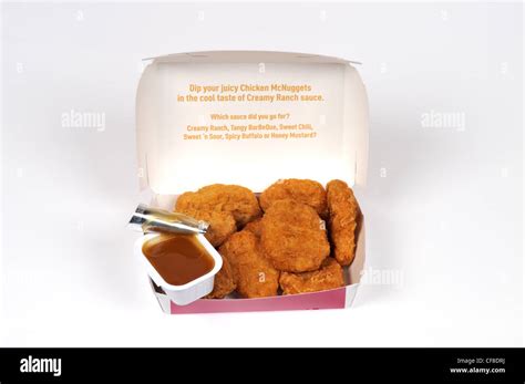 McDonald's chicken mcnuggets in box packaging and dipping sauce with ...