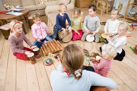 A group of children playing musical ... | Stock image | Colourbox