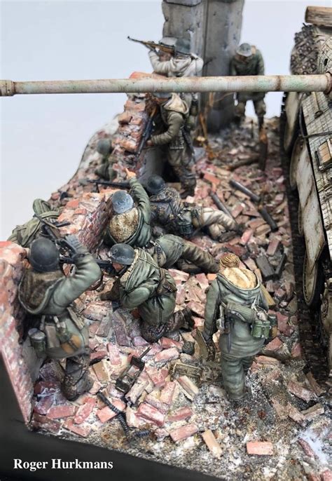 some toy soldiers are playing in the rubble