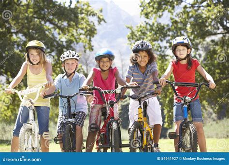 Group of Children Riding Bikes in Countryside Stock Image - Image of ...