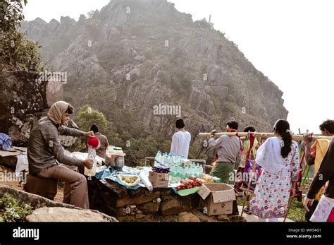 Parasnath, Jharkhand, India May 2018 - A man selling food and some ...