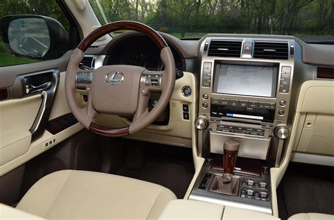 the interior of a car with beige leather and wood trims, including ...