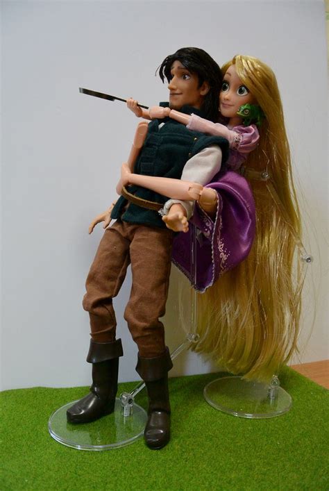 the doll is holding on to the man's shoulder with an arrow in his hand