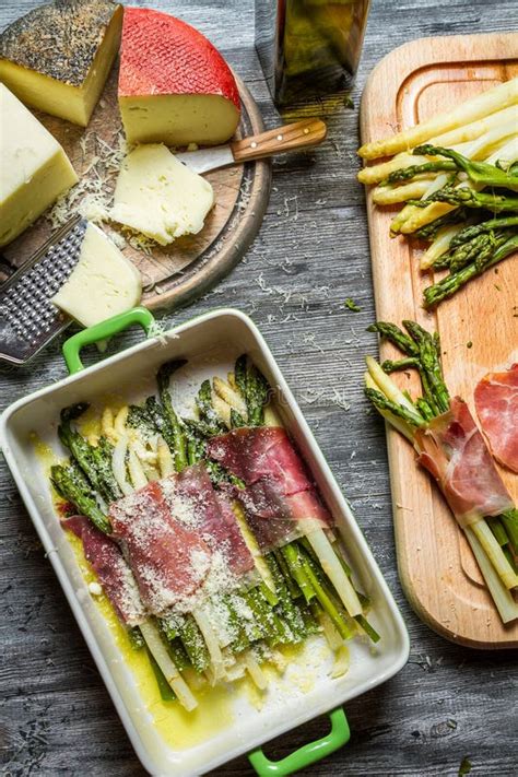 Asparagus Wrapped in Parma Ham with Cheese Stock Photo - Image of ...