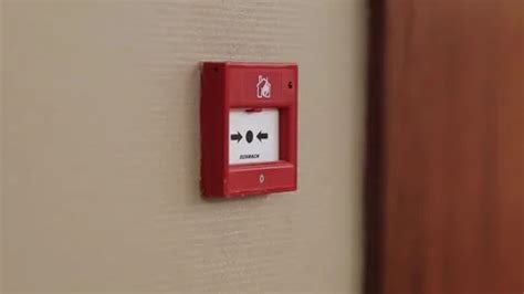 Red fire alarm button on the wall in the... | Stock Video | Pond5