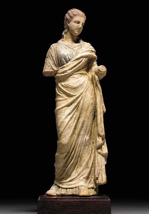 A GREEK TERRACOTTA FIGURE OF A WOMAN Hellenistic Period, Circa 3rd ...