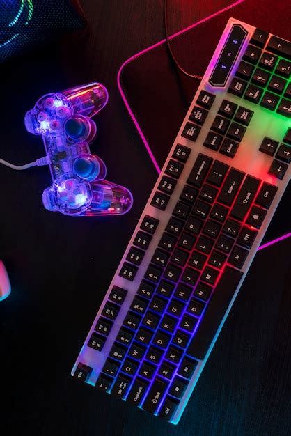 Free Photo | View of illuminated neon gaming keyboard setup and controller