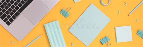 Header with Laptop and Scattered Stationery on a Yellow Background ...