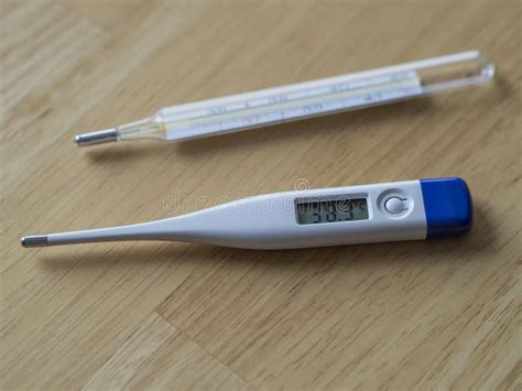 Electric Clinical Thermometer Showing High Fever Temperature and Stock ...