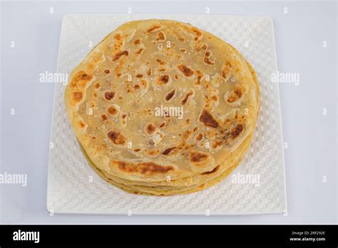 Chapati Mandazi Andazi Samosa triangular-shaped snacks on a plate on a ...