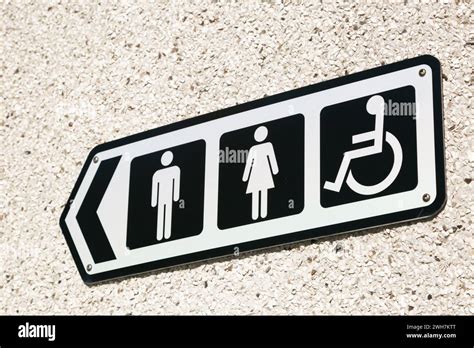 UK public toilet sign outside showing male, female and disabled Stock ...