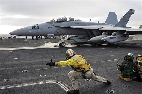 U.S. Navy aircraft carrier flight deck crews use computer simulation to ...