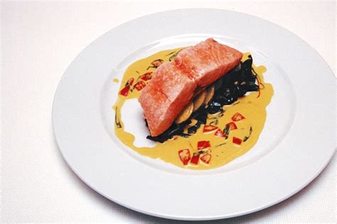 Confit of Salmon on New Potatoes and Silverbeet with a Saffron Cream Sauce