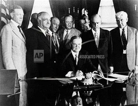 President Herbert Hoover enacts farm relief into law by signing the ...