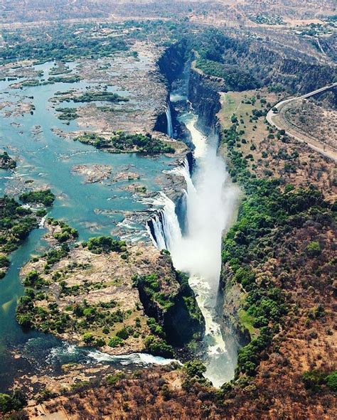 The magnificent Victoria Falls on the Zambezi River at the border of ...