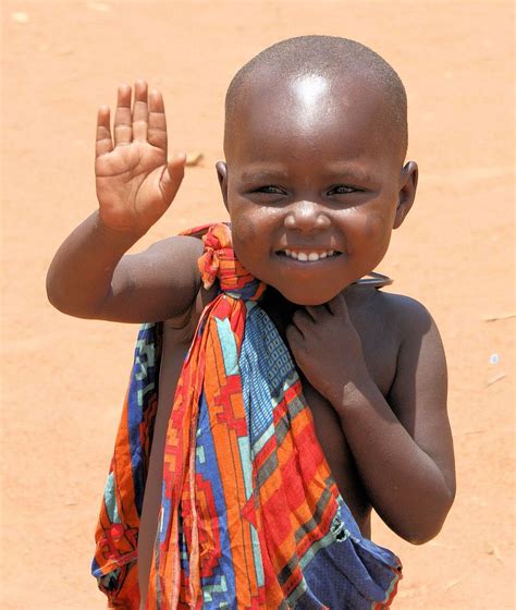 A cute little toddler in Africa waving to someone [866×1024] | Pois ...