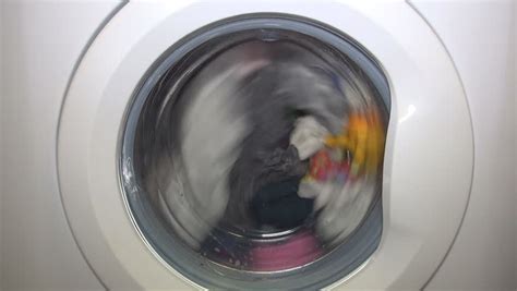 Close Up View Of Clothing Spinning In Washing Machine In Slow Motion ...