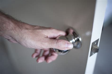 Free Image of Man Hand Holding a Knob in Opening the Door | Freebie ...