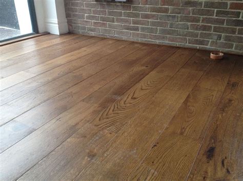 Unfinished brushed oak engineered wood flooring stained dark and then ...