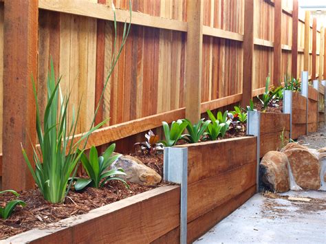 Timber retaining wall on boundary fence. This is going to look great ...