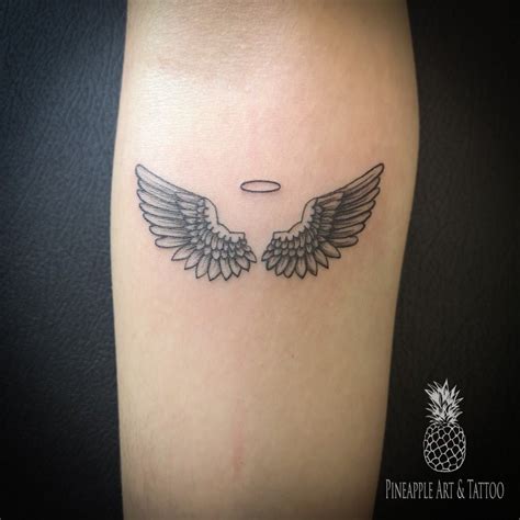 Angel wings tattoo | Wrist tattoos for guys, Small tattoos for guys ...