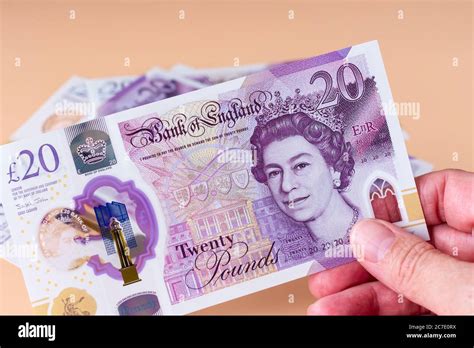 New plastic polymer British, English £20 pound notes Stock Photo - Alamy