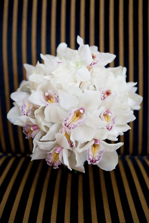 white orchid bridal bouquet with touches of pink