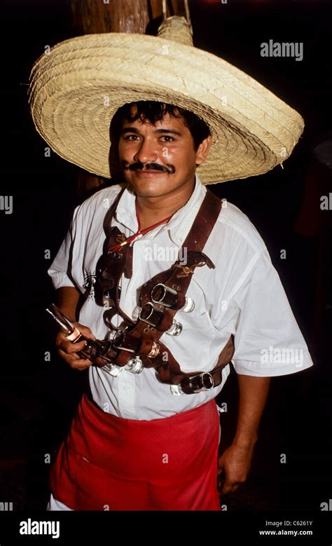 Mexican waiter with a big hat and a bullet belt with tequilla Stock ...