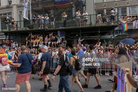 A large crowd watches the NYC Pride March 2023 on 5th Avenue, between ...