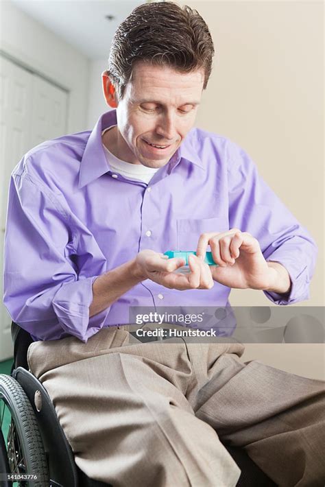 Quadriplegic Man In Wheelchair With Spinal Cord Injury Opening Pill ...