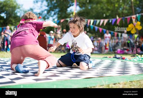 Children take part in a sock wrestling competition in the kids field on ...