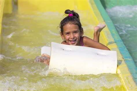 Girl on the water slide — Stock Photo © vladislavgajic #85915642