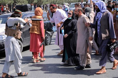 As Afghan women protest the Taliban, warning shots disperse crowd