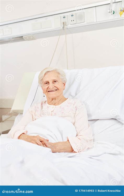 Senior Woman in Hospital Bed Smiles Contentedly Stock Image - Image of ...