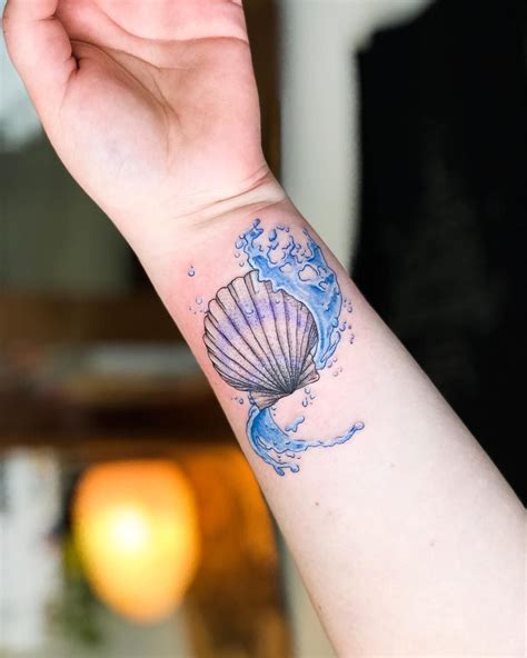 Colourful seashell tattoo by Dutch artist @captaincubetattoo Just keep ...