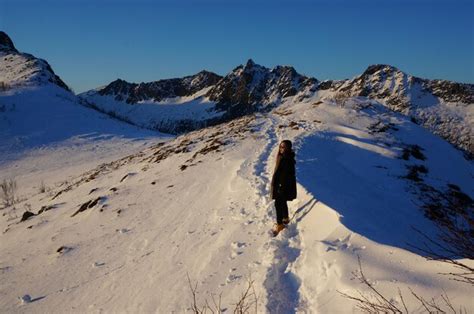 Premium Photo | Full length of woman standing on snow covered mountain