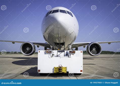 Aircraft Connected To Pushback Tug Tractor Royalty-Free Stock ...