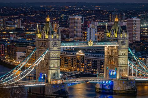 Tower bridge seen at night in London. Photograph by George Afostovremea ...